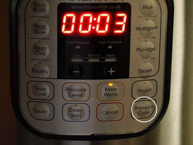 press the pressure cook button of instant pot