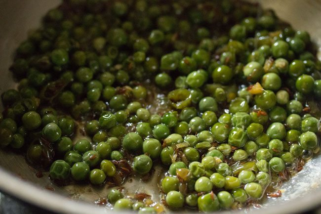 preparing matar poha recipe