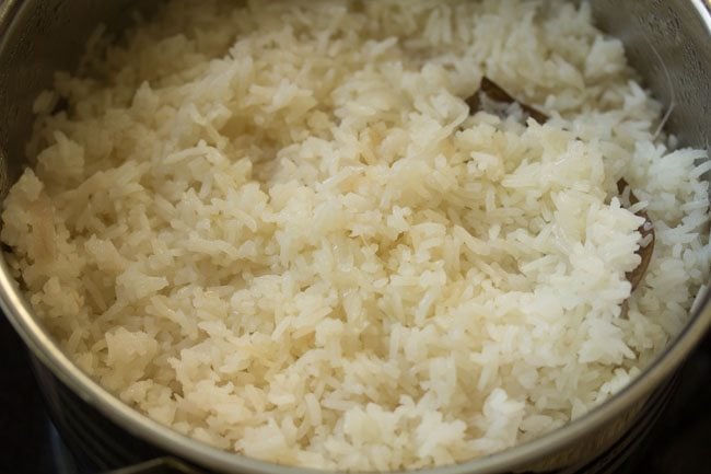 cooked rice fluffed and neychoru ready to be served.