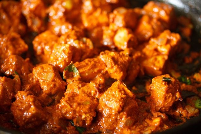 mixing marinated paneer with onion mixture
