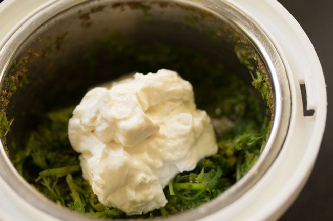 yogurt added to grinder to finish making creamy green chutney.