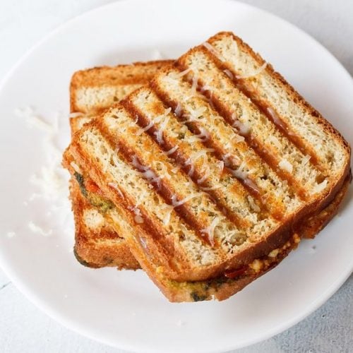 paneer sandwich served on a white plate.