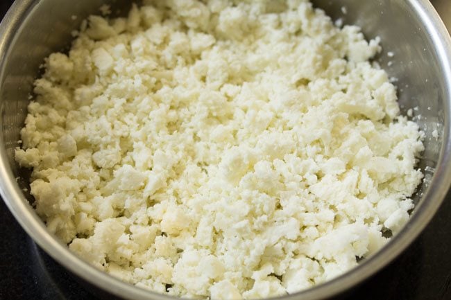 crumbled paneer in a bowl for stuffing. 