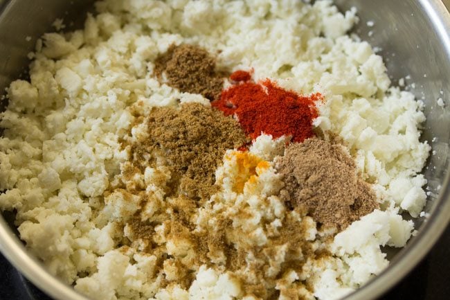 spice powders added to the crumbled paneer. 