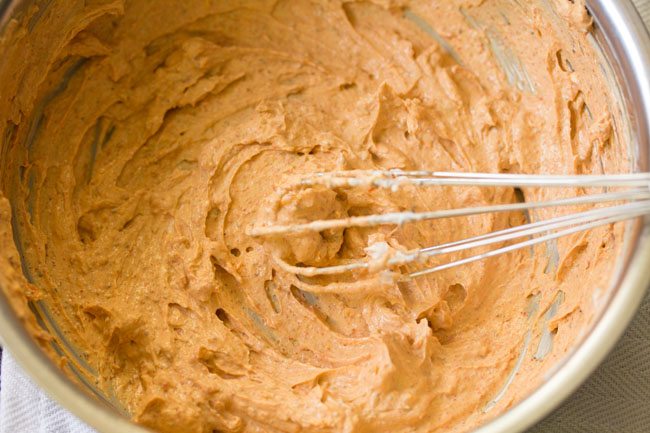 curd and spices have been whisked together.