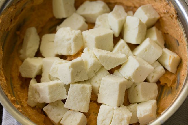 cubed paneer added to tikka marinade.