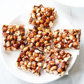 ppeanut chikki squares on a white plate