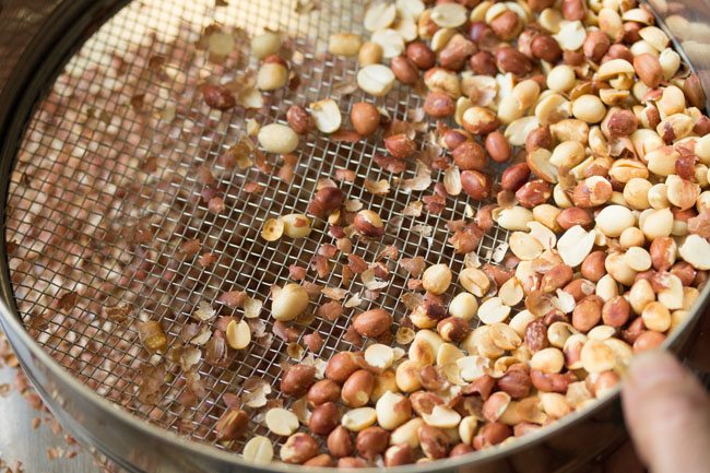 husks being removed from peanuts