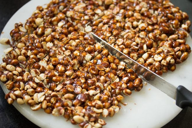 Cutting chikki with a knife
