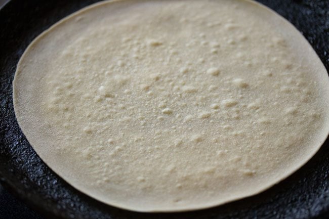 small bubbles are all over the surface of the roti.