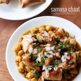 samosa chaat served on a white plate with a plate of samosas kept on the top right side and text layover.