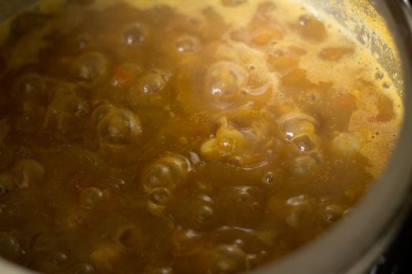 cooking the curry till it becomes slightly thick