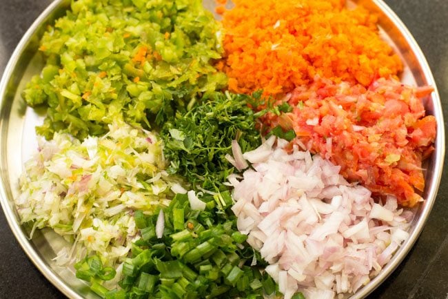 finely chopped vegetables on a steel plate. 