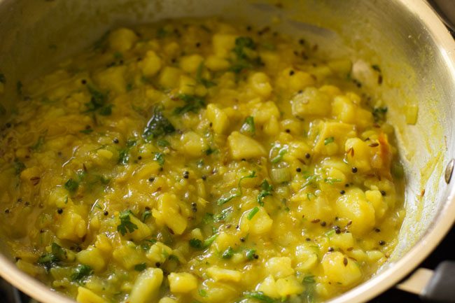 coriander leaves mixed in the potato masala.