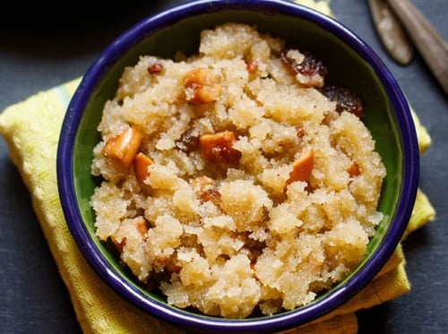 sooji ka halwa served in a blue colored bowl.