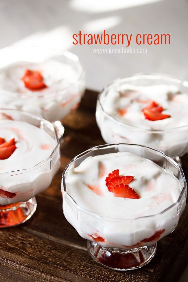 strawberry cream garnished with fresh strawberry slices and served in ice cream cups.