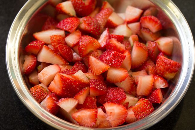 chopped fresh strawberries in a bowl. 