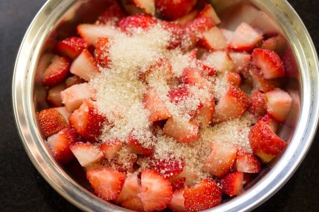sugar added to chopped strawberries. 
