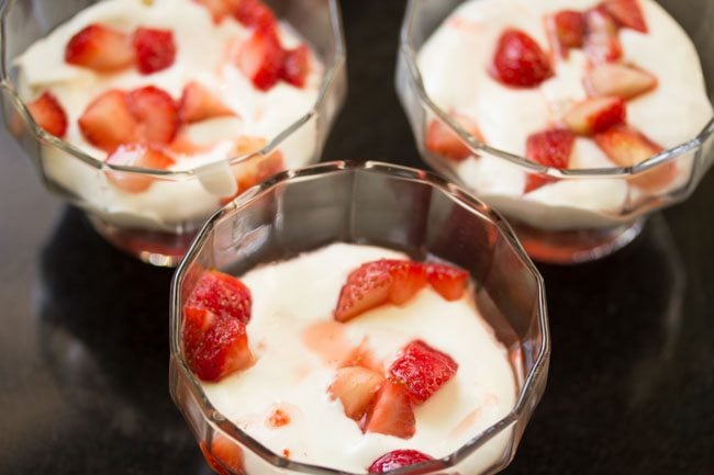 more macerated strawberries added on top of the whipped cream. 