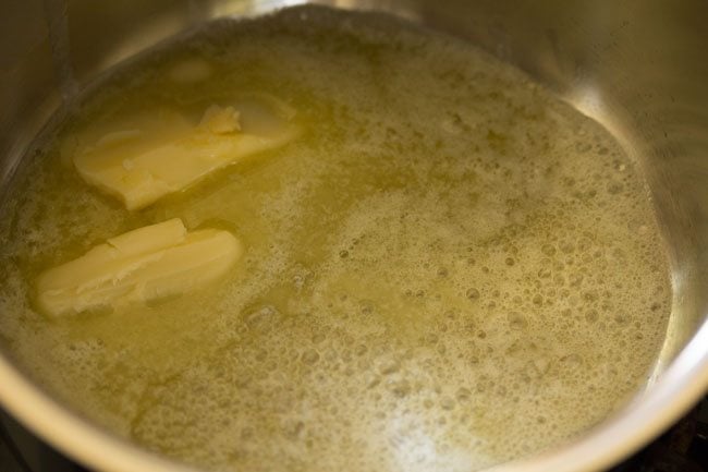 heating butter in a pan for white sauce recipe. 