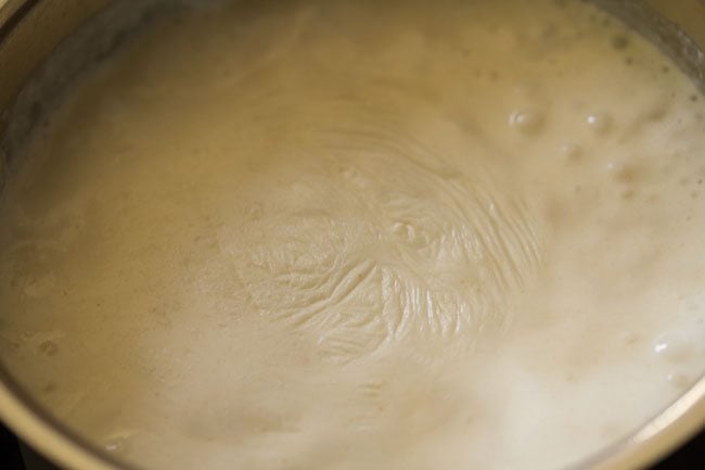 simmering béchamel sauce. 