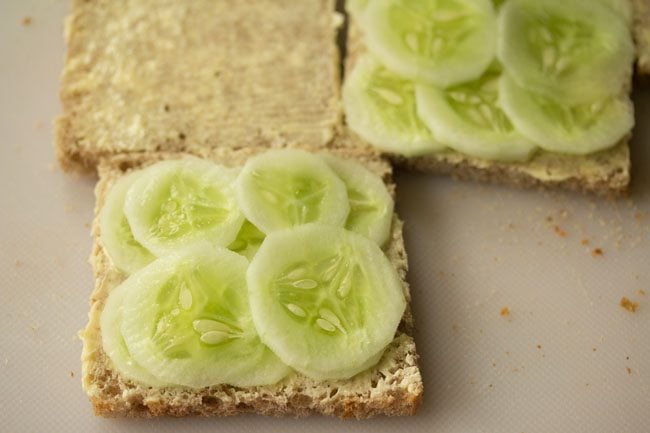 buttered bread topped with cucumber slices