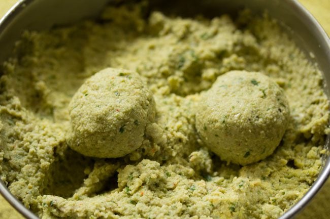 making falafel balls from mixture