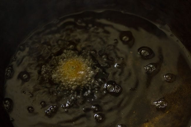 frying falafel in wok