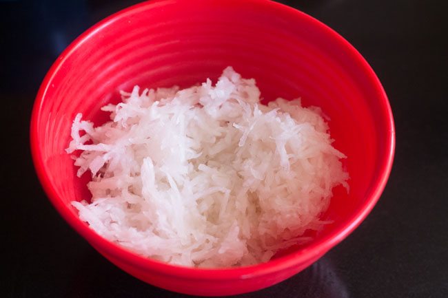 grated radish in a red bowl