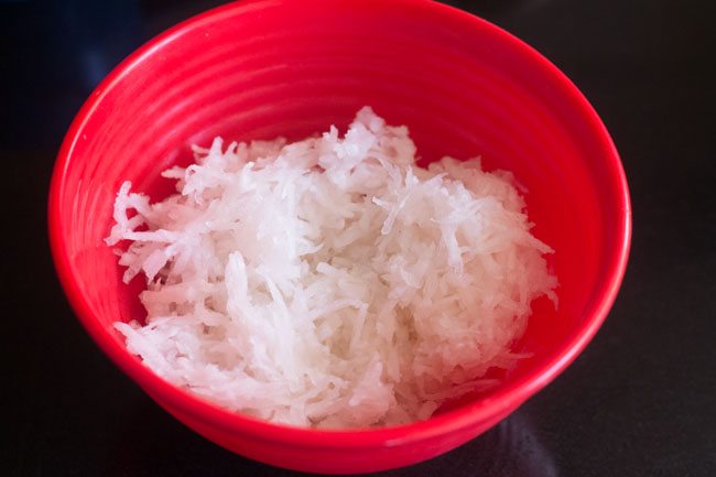 grated radish in a red bowl. 