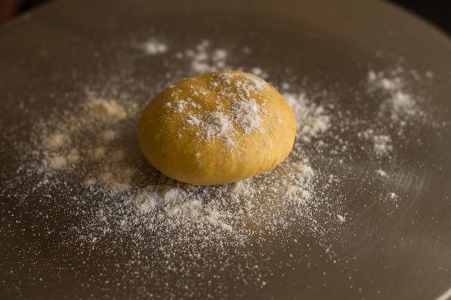 flour sprinkled on a dough ball. 