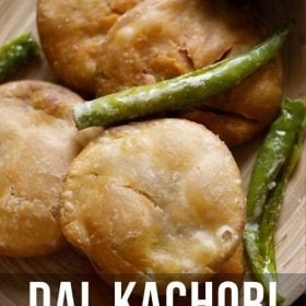 kachori in a tray with green fried chillies on top with text layovers.