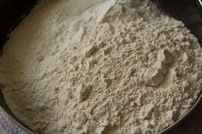 whole wheat flour and all purpose flour added in a mixing bowl. 