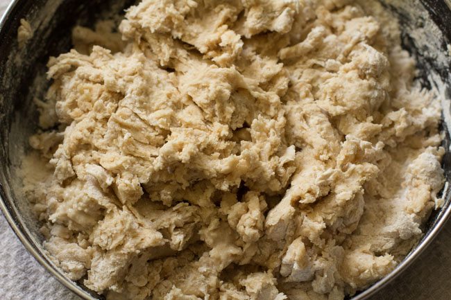 kneading dough for making cheese garlic naan. 