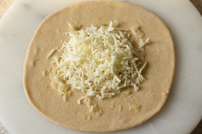 disc topped with grated cheese. 