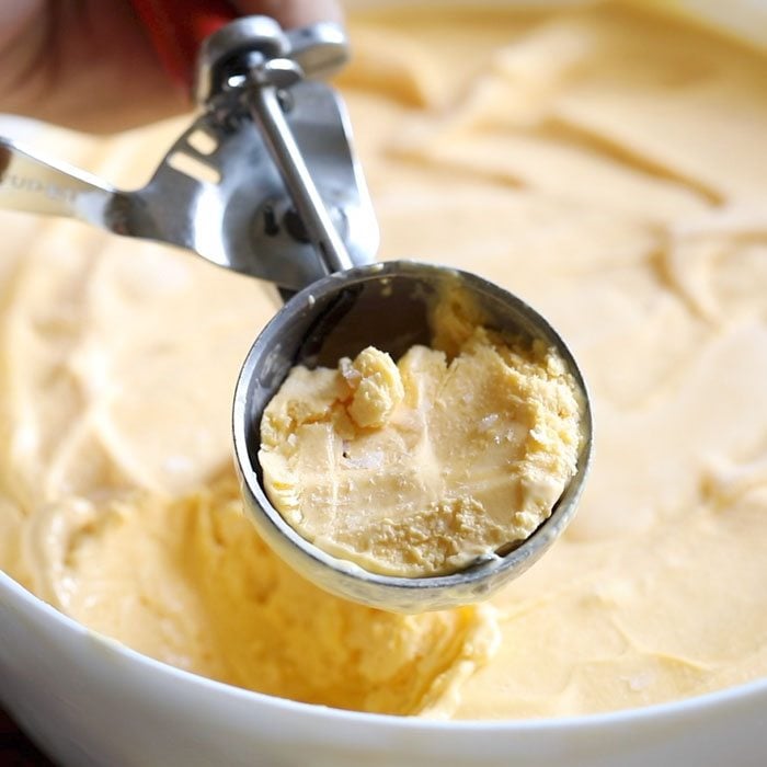 mango ice cream scoop in an ice cream scoop