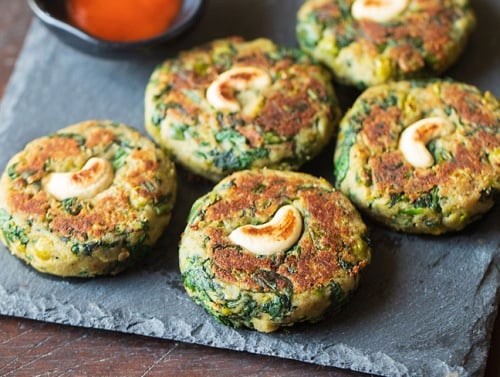 hara bhara kabab on a grey granite tray