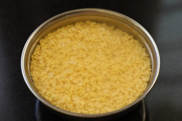 moong dal soaking in water in bowl.