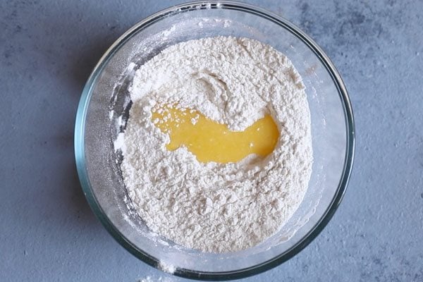 ghee on flour in bowl.