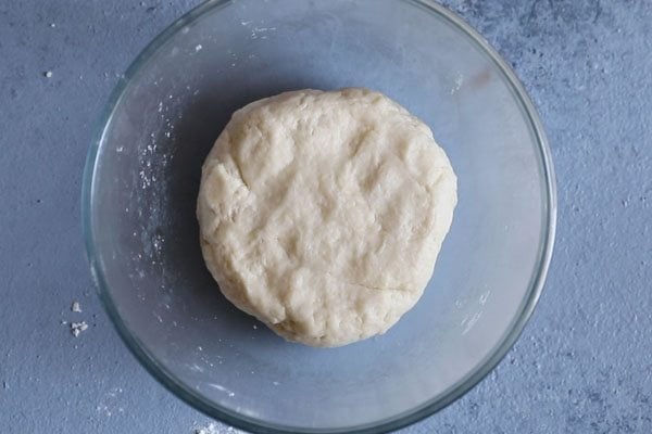 dough in glass bowl.