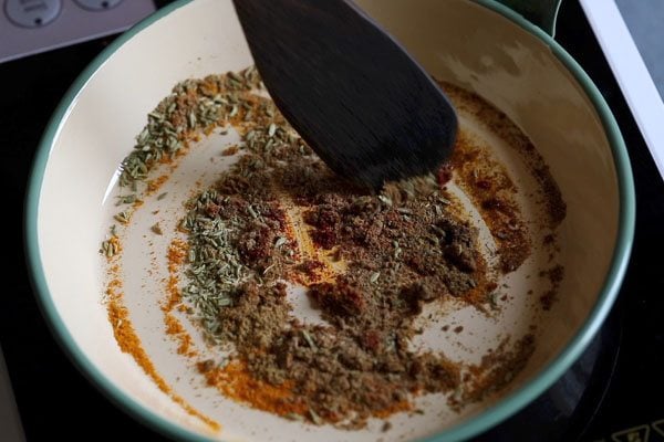 ground spices being sautéed. 