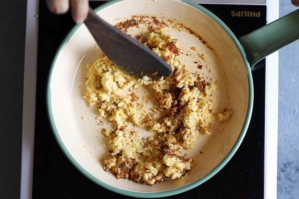 moong lentil paste being mixed with spices.