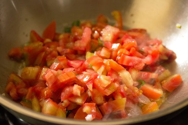 finely chopped tomatoes added to the pan. 