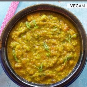 matar ka nimona garnished with coriander leaves and served in a ceramic bowl wit text layovers.