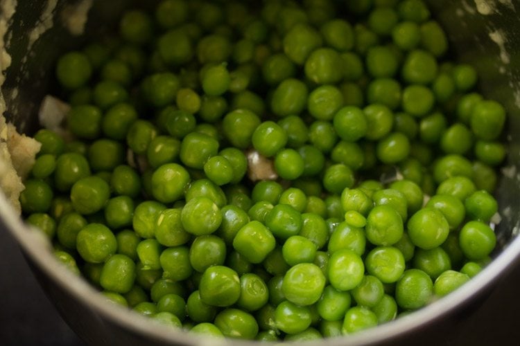 green peas added to jar