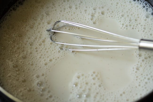 whisking milk and sugar