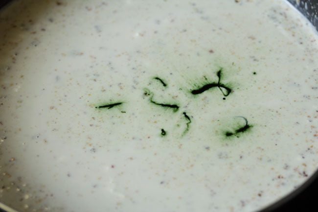 green food coloring added to pistachio ice cream mixture