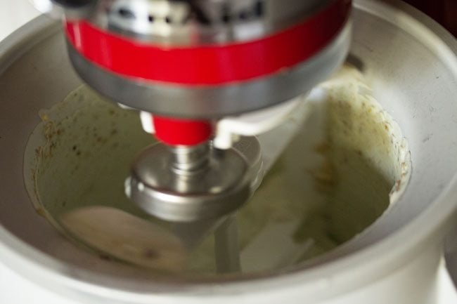 churning pista ice cream in ice cream maker