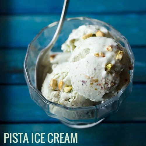pistachio ice cream scoops in bowl with a spoon on blue table with text layovers