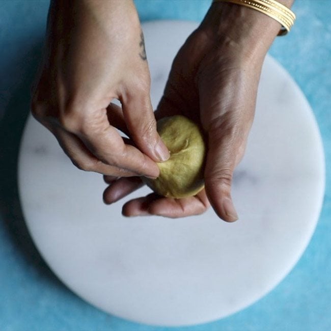 pressing edges at the center for making bobbatlu recipe. 